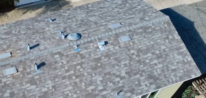 The same roof from above finished in gray architectural shingles