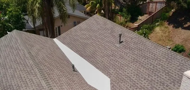 The same home from above with new tan architectural shingles