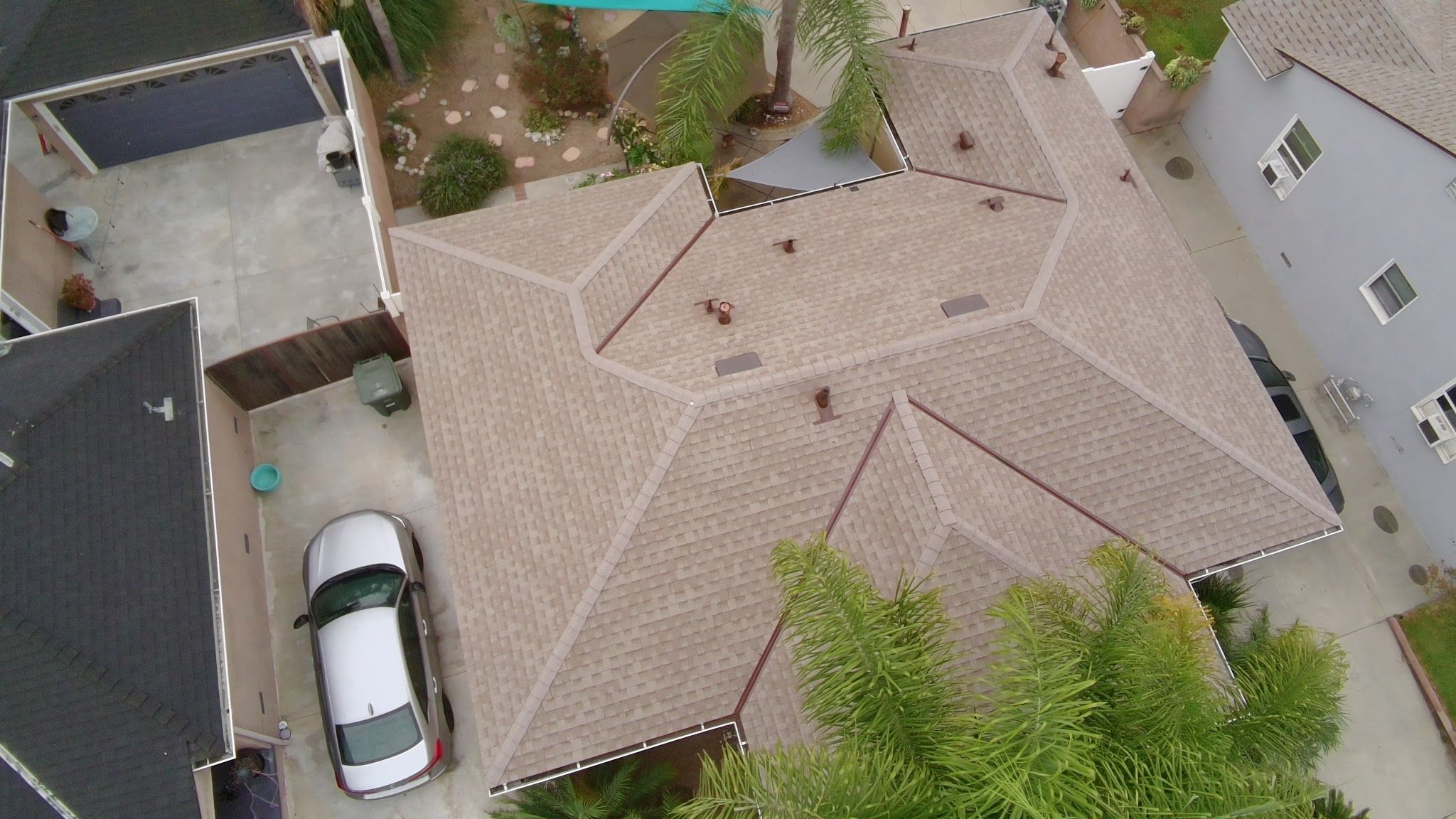 Aerial view of a finished hip roof with architectural shingles