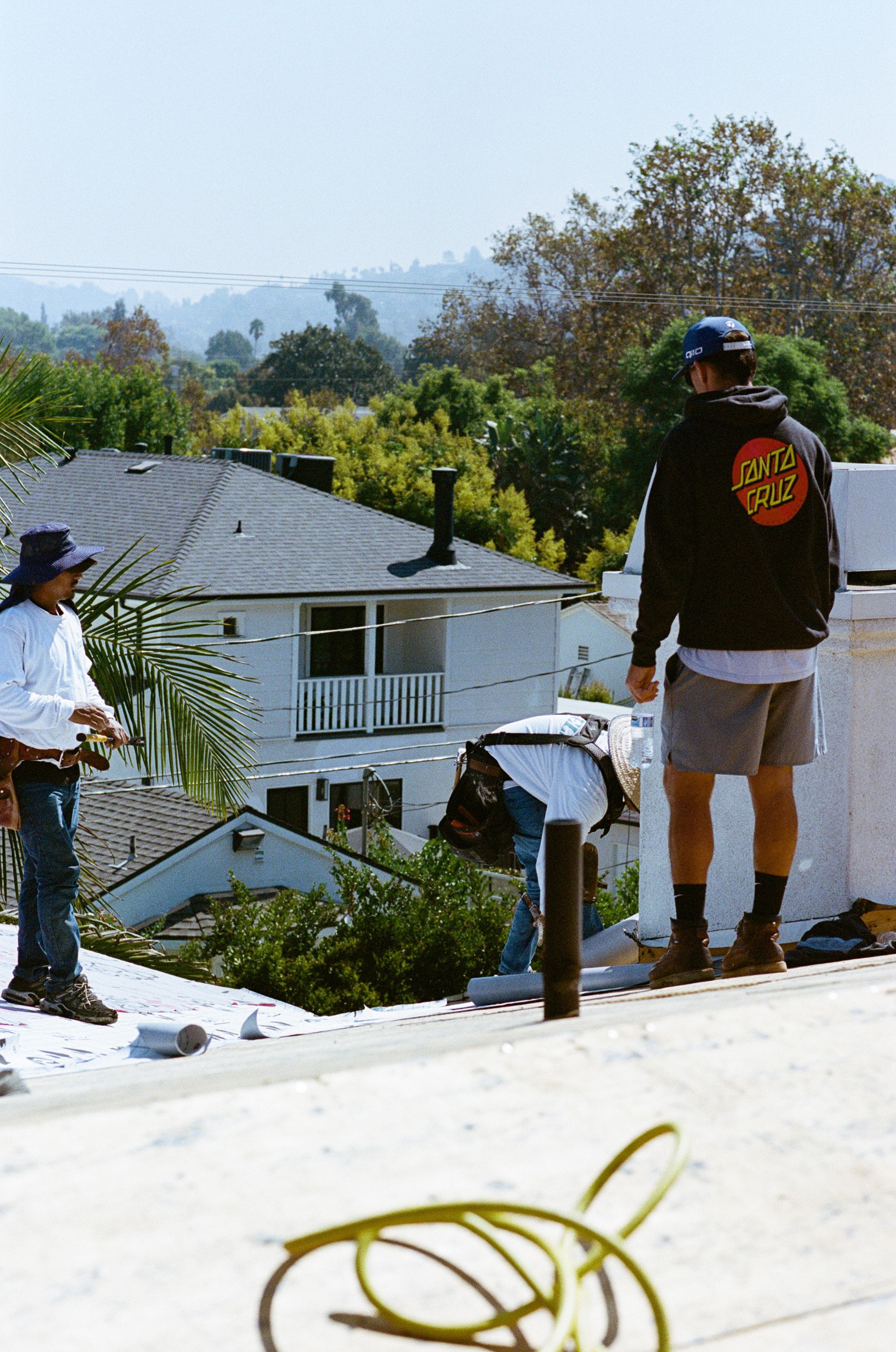 Swell Roofing crew working together on a residential roof