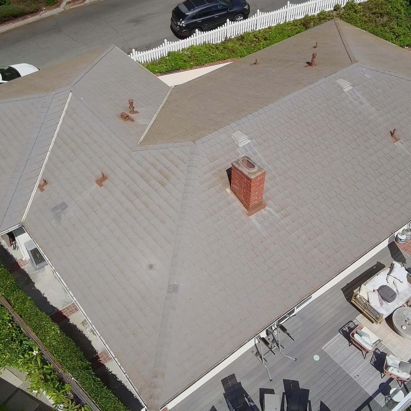 Drone view documenting wear across a residential shingle roof