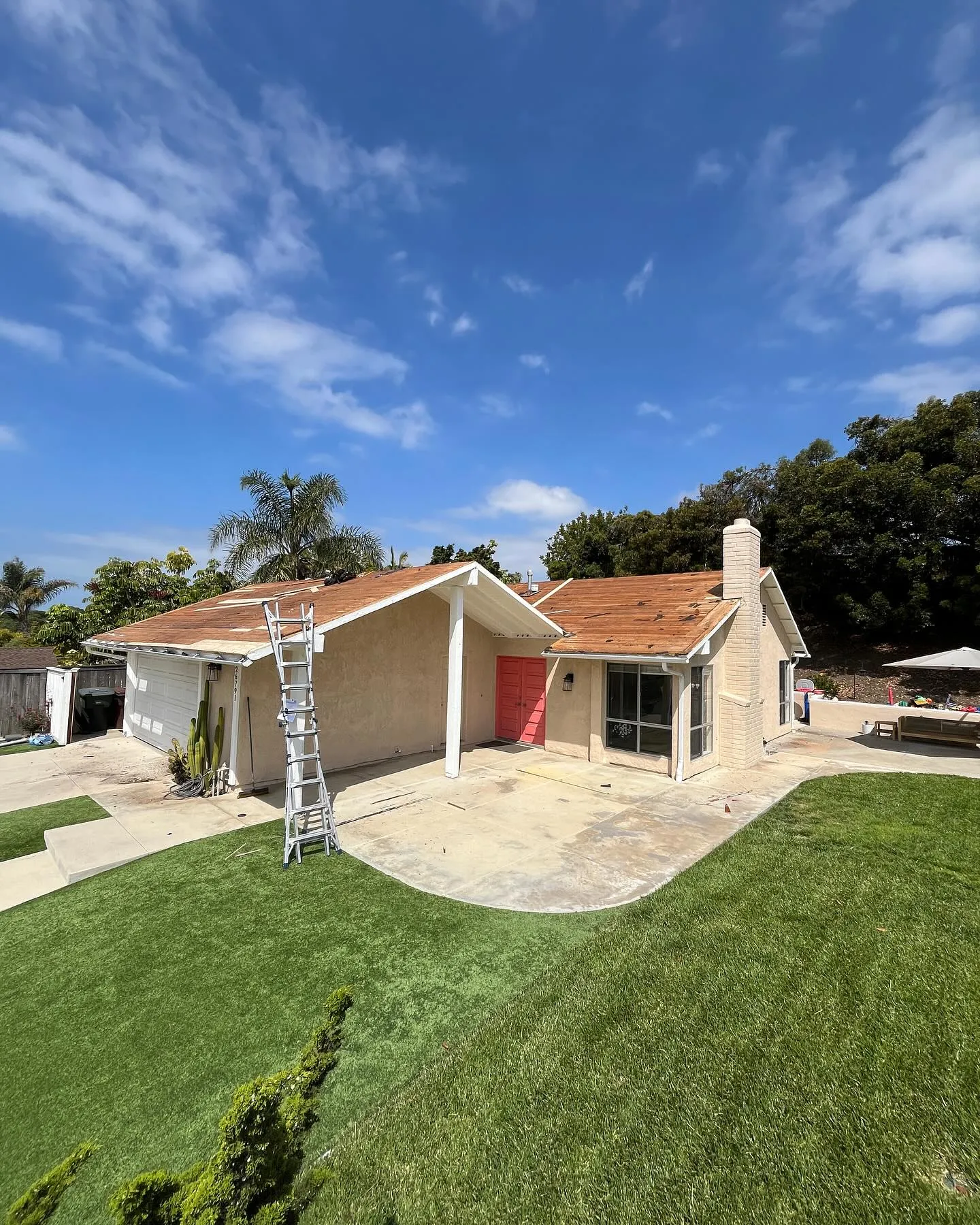 Ranch house stripped to the deck during a residential re-roof