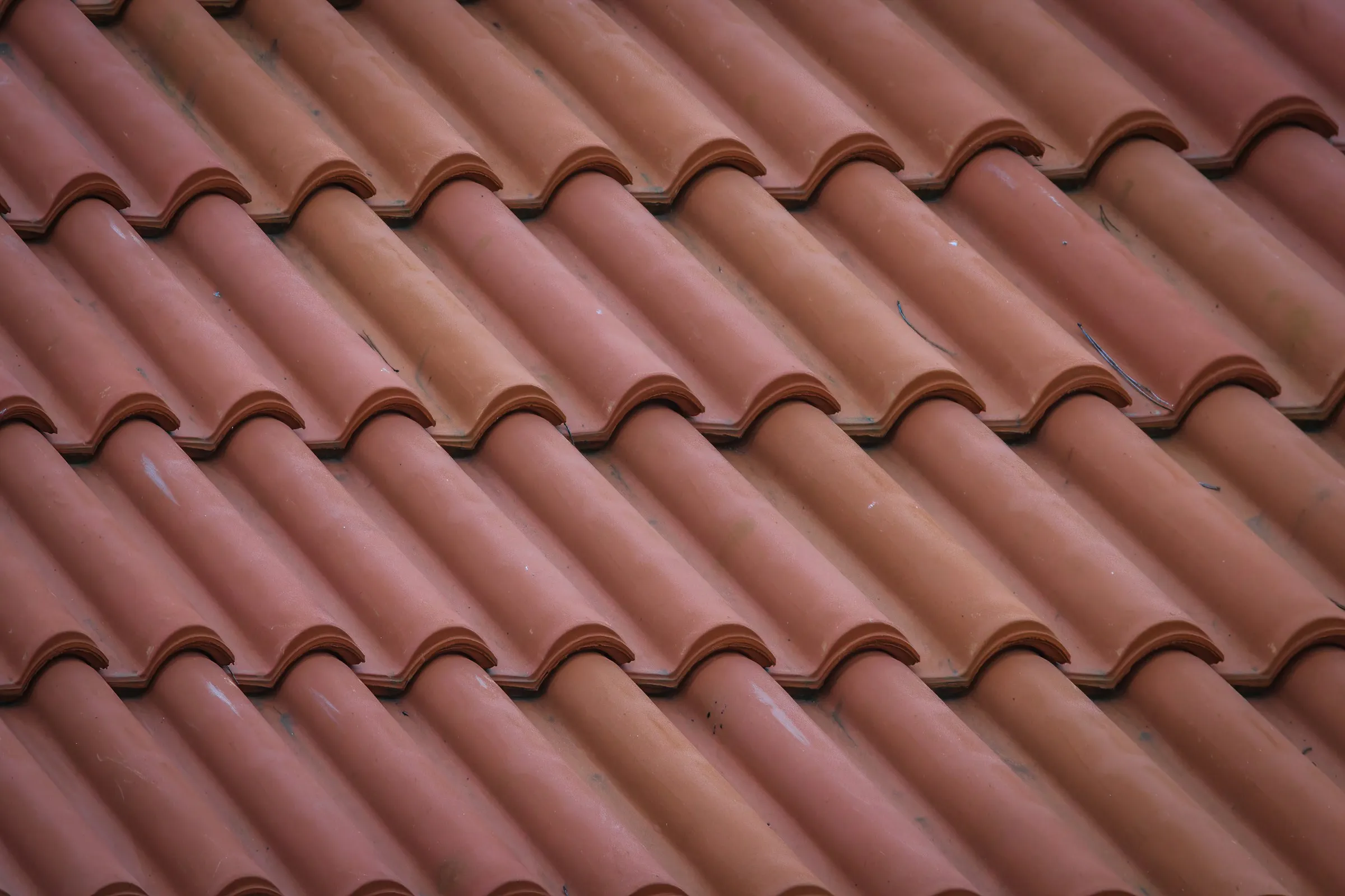 Close view of a terracotta Spanish barrel tile roof